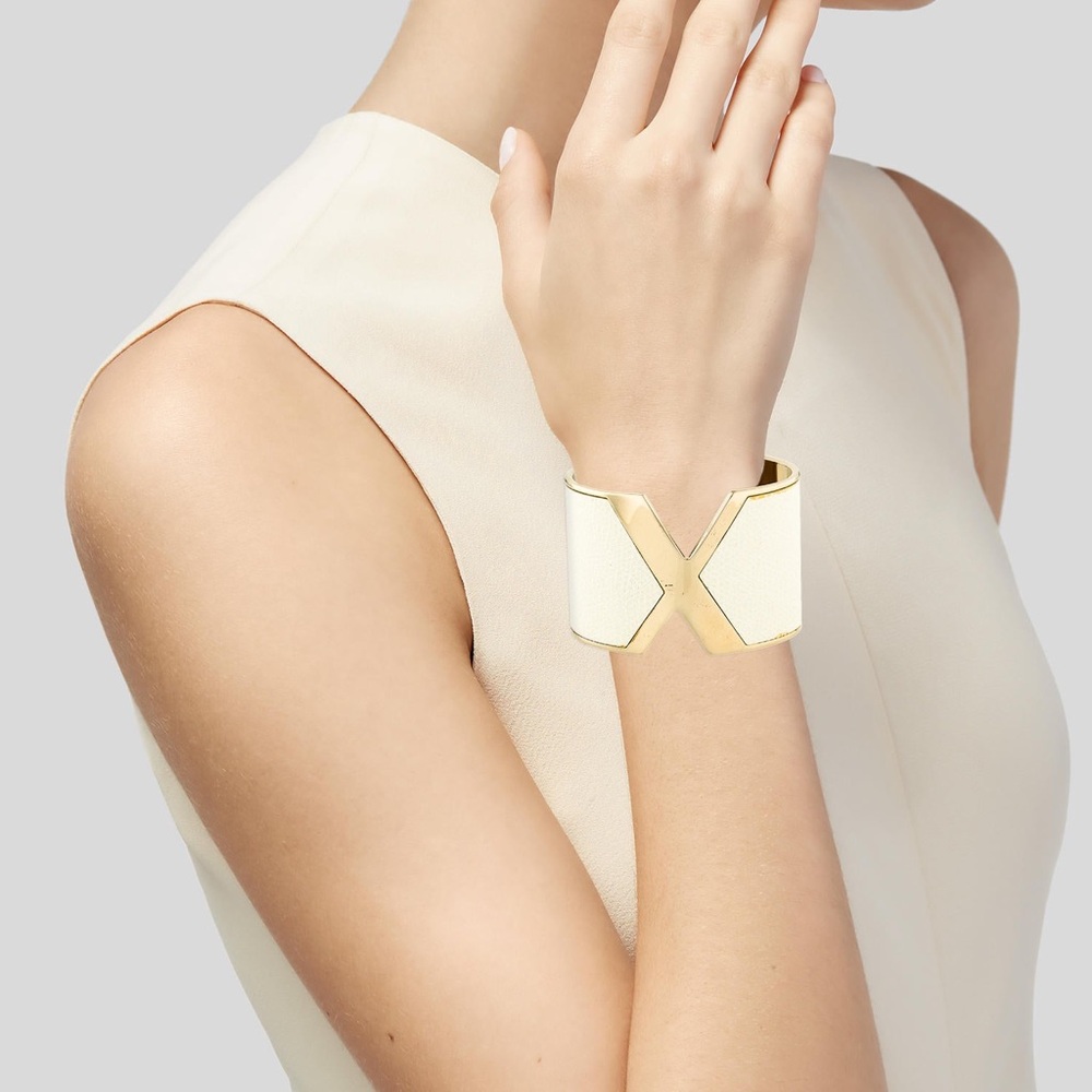 Gold-tone Valextra VX cuff with leather.